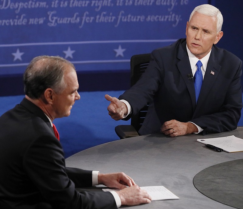 Republican vice-presidential nominee Gov. Mike Pence, right, attempts to get a word in with the constantly interrupting Democratic vice-presidential nominee Sen. Tim Kaine during their Tuesday debate at Longwood University in Farmville, Va.