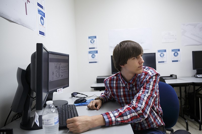 Matt Fulbright, a freshman at Chattanooga State Technical Community College, sits at the computer station where he uses the AutoCAD program to perform computer aided drafting for the Tennessee Valley Authority's CADnet program on Thursday, Sept. 22, 2016, in Chattanooga, Tenn. The training helps students gain real-world engineering experience.