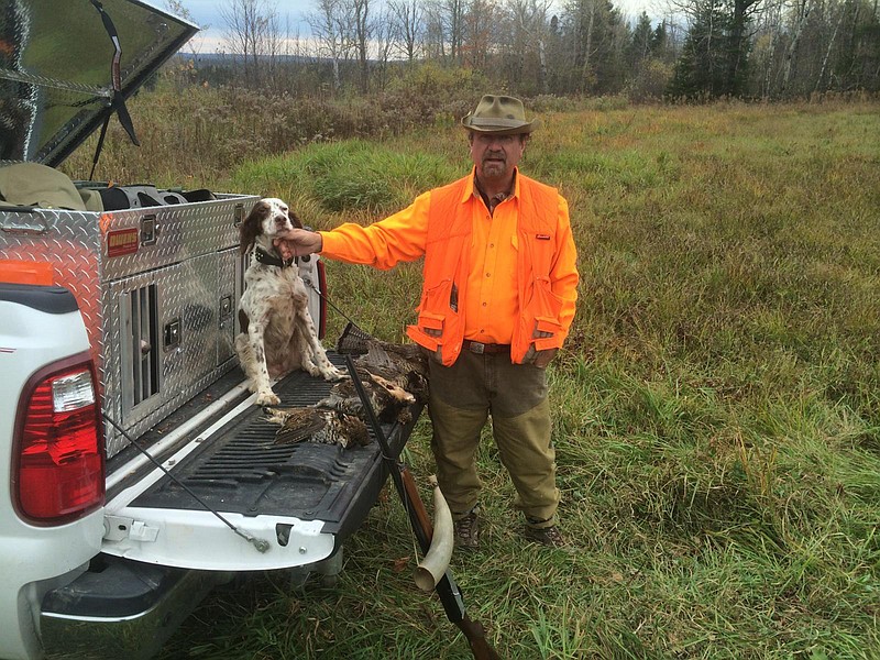 Kevin Murphy and his English setter display some of the rewards of a grouse hunt. The reasons why people hunt, fish or otherwise feel the need to be in the outdoors are abundant, varied and sometimes hard to define, writes outdoors columnist Larry Case.