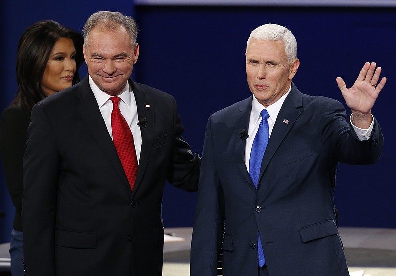 Republican vice-presidential nominee Gov. Mike Pence, right, and Democratic vice-presidential nominee Sen. Tim Kaine stand before the audience during the vice-presidential debate at Longwood University in Farmville, Va., Tuesday, Oct. 4, 2016.