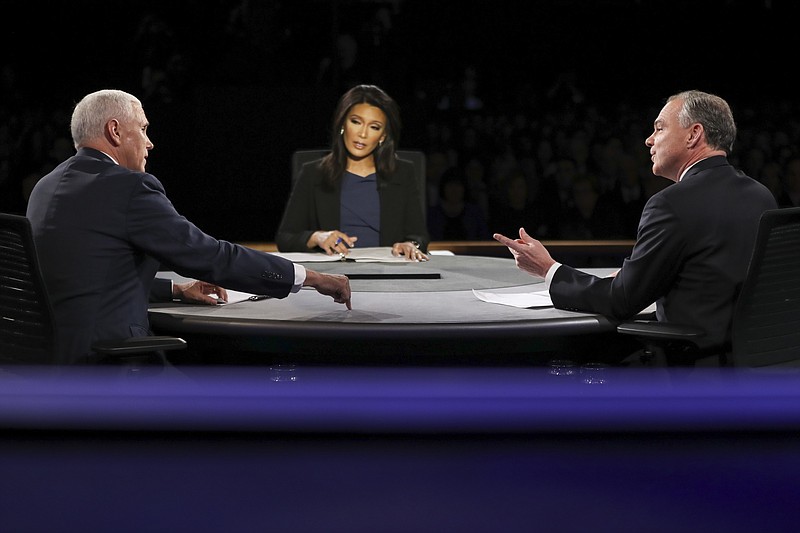 Republican vice-presidential nominee Gov. Mike Pence, left, and Democratic vice-presidential nominee Sen. Tim Kaine exchange opinions as Moderator Elaine Quijano of CBS News listens during the vice-presidential debate at Longwood University in Farmville, Va., Tuesday, Oct. 4, 2016.