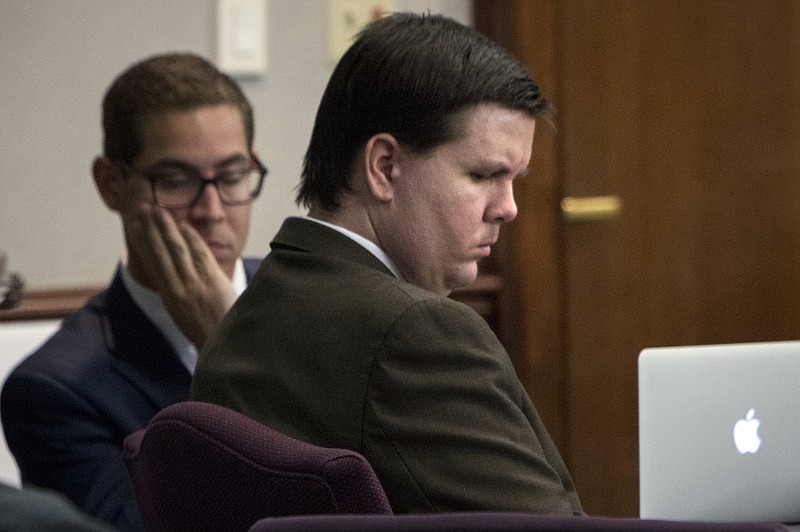 
              Justin Ross Harris listens to Cobb County Senior Assistant District Attorney Chuck Boring's opening remarks during his trial at the Glynn County Courthouse in Brunswick, Ga., Monday, Oct. 3, 2016. Harris is charged with murder after his toddler son died two years ago while left in the back of a hot SUV. (Stephen B. Morton/Atlanta Journal-Constitution via AP, Pool)
            