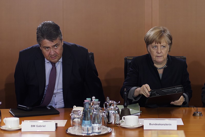 
              German Chancellor Angela Merkel, right, and Vice Chancellor and Economy Minister Sigmar Gabriel arrive for the weekly cabinet meeting of the German government at the chancellery in Berlin, Wednesday, Oct. 5, 2016. (AP Photo/Markus Schreiber)
            