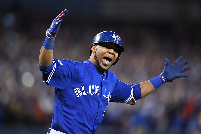 Toronto Blue Jays' Edwin Encarnacion celebrates his walk-off three-run home run during the 11th inning of an American League wild-card baseball game in Toronto, Tuesday, Oct. 4, 2016.