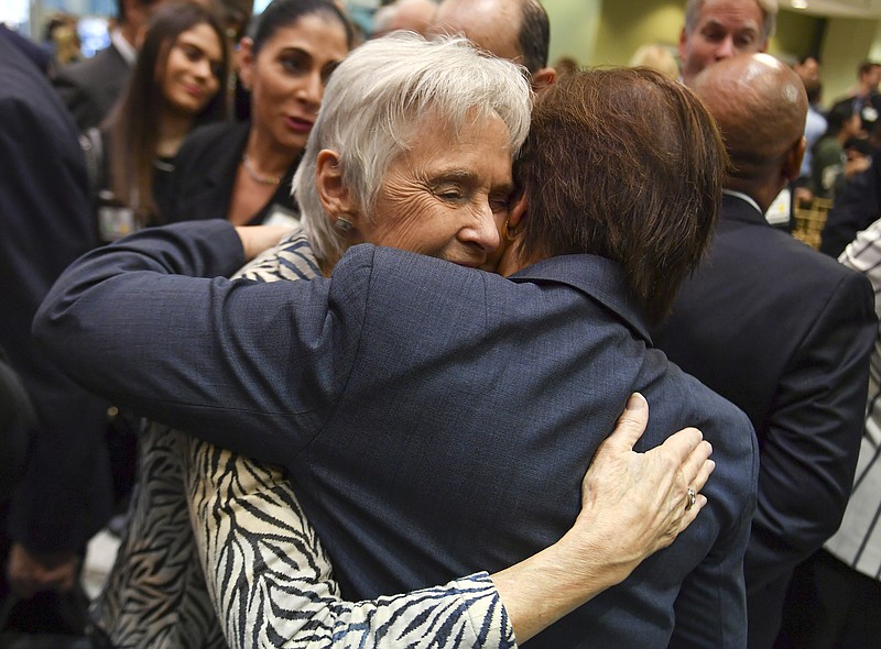 
              Maureen Scalia, wife of the late Justice Antonin Scalia, left, gets a hug from Justice Elena Kagan, following the dedication of the Antonin Scalia Law School at George Mason University on  Thursday, Oct. 6, 2016 in Arlington, Va.  Kagan praised the late justice and conservative icon for transforming legal culture and challenging law students "to think harder than they've ever thought before." (Ricky Carioti/The Washington Post via AP)
            