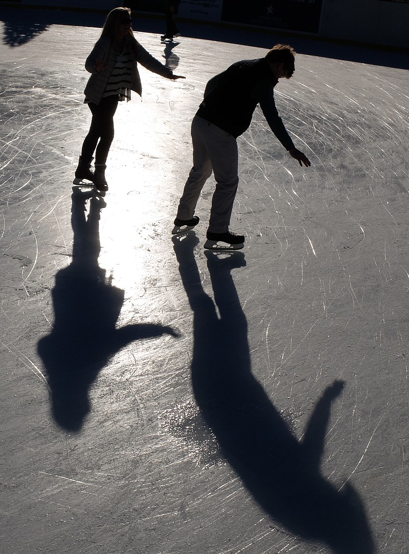 Notre Dame HIgh student Zach Leath, right, enjoys ice skating with his older sister, Jessica, on her birthday Friday at Ice on the Landing. "I just finished my exams at UTK yesterday, so this is fun time," Leath said as she and her brother circled the rink.