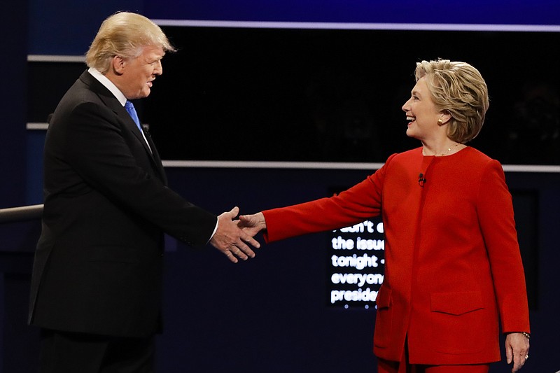 Republican presidential nominee Donald Trump and Democratic presidential nominee Hillary Clinton shake hands during the presidential debate at Hofstra University in Hempstead, N.Y., Monday, Sept. 26, 2016.