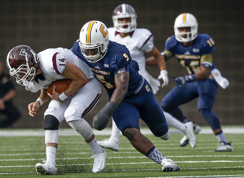 UTC linebacker Nakevion Leslie (5) sacks Fordham quarterback Kevin Anderson in the first half of the Mocs' FCS playoff football game against Fordham at Finley Stadium on Saturday, Nov. 28, 2015, in Chattanooga, Tenn.