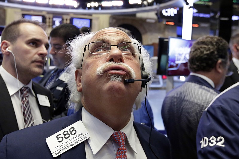 
              Trader Peter Tuchman, center, works on the floor of the New York Stock Exchange, Wednesday, Oct. 5, 2016. Energy stocks are leading an early gain on Wall Street as the price of crude oil moves higher. (AP Photo/Richard Drew)
            