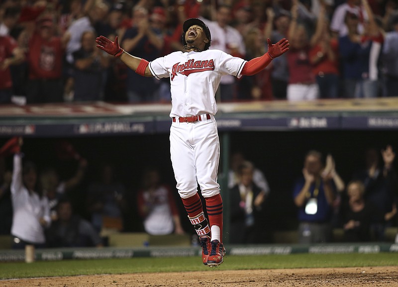 
              Cleveland Indians' Francisco Lindor celebrates his solo home run against the Boston Red Sox in the third inning during Game 1 of baseball's American League Division Series, Thursday, Oct. 6, 2016, in Cleveland. (AP Photo/Aaron Josefczyk)
            