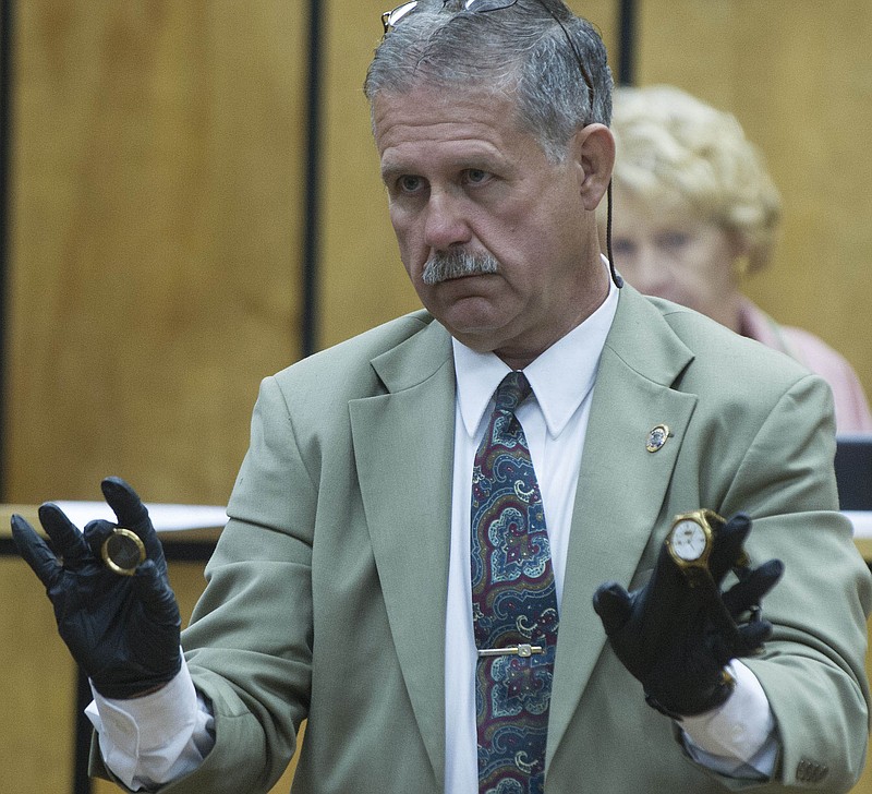 Monroe County Sheriff's Office Investigator Doug Brannon testifies about a watch owned by Jim Miller that was on his wrist when he was killed during Jessica Kennedy's murder trial Thursday, Aug. 16, 2012, in Monroe County Criminal Court.