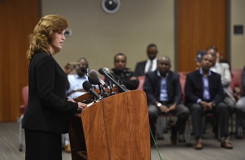 
              Stearns County Attorney Janelle Kendall reads a letter Thursday, Oct. 6, 2016, clearing off-duty officer Jason Faulkner in the shooting of Dahir Adan after Adan stabbed multiple people at Crossroads Center in St. Cloud, Minn., on Sept. 17. The man who stabbed multiple people at Crossroads Center had become interested in Islam in the last several months, withdrew from his friends and encouraged female relatives to be more religious, the FBI said Thursday. (Dave Schwarz/ the St. Cloud Times via AP)
            