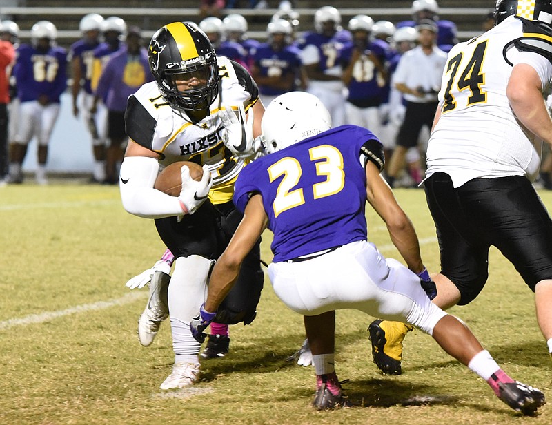 Hixson's Myles Ratliff (17) runs the ball toward Central's Gavin Spotts (23) in first half action at Central Friday night.