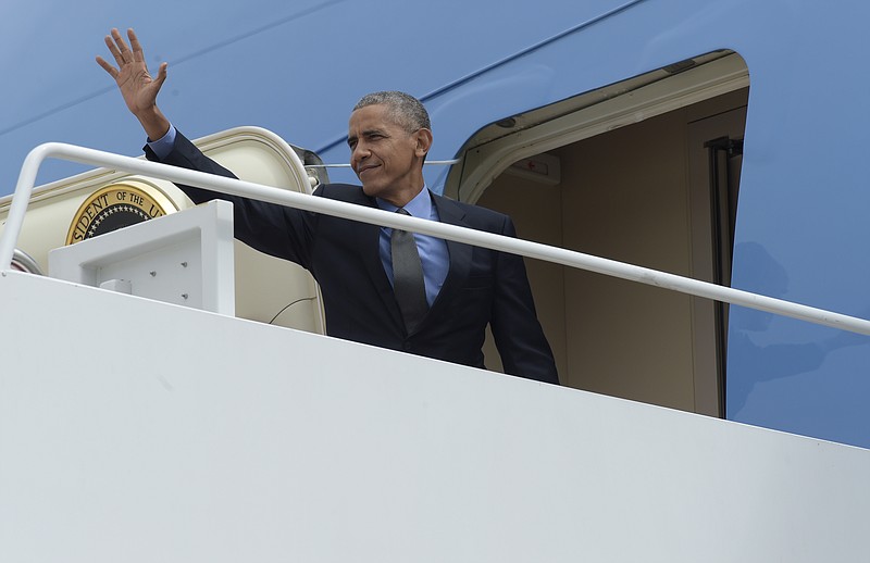 
              President Barack Obama waves from the top of the steps of Air Force One at Andrews Air Force Base in Md., Friday, Oct. 7, 2016. Obama is traveling to Chicago for the weekend. (AP Photo/Susan Walsh)
            
