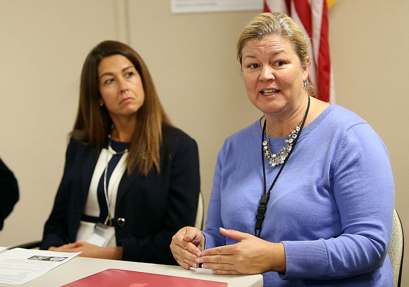 
              In this Sept. 13, 2016 photo, Sam Walsh, right, intervention counselor, speaks at a press conference about the recent deaths of two 13-year-old boys as well as about the dangers of a new synthetic drug called pink or pinky at the Park City School District office in Park City, Utah. The deaths of the two teens in the Utah ski resort town, that may be connected to a new synthetic drug, is emblematic of law enforcement’s struggle to keep up with ever-evolving chemical compounds amid a national epidemic of opioid drugs. (Kristin Murphy/The Deseret News via AP)
            