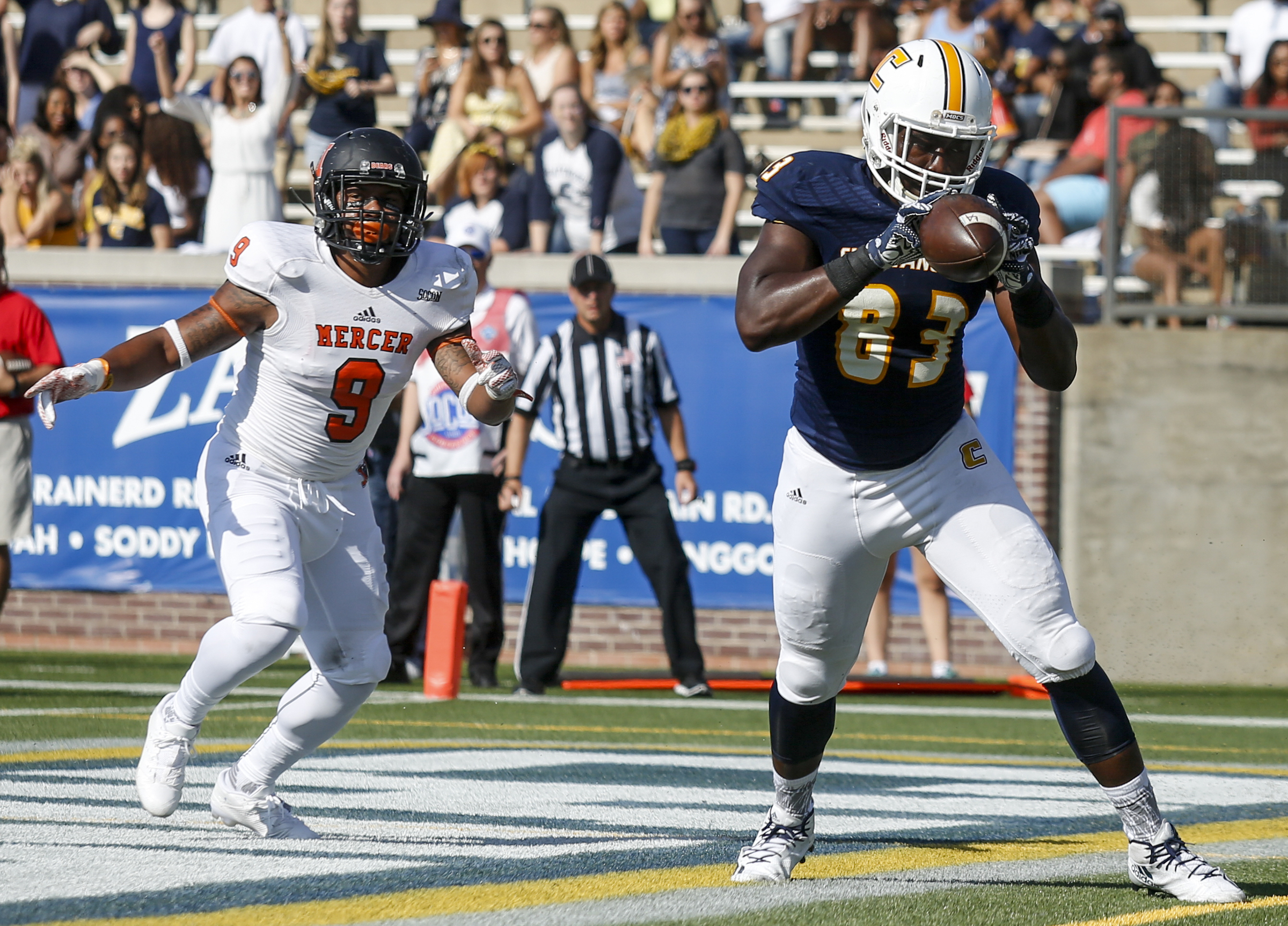 UTC tight end Malcolm Colvin catches a pass in the end zone for a touchdown ahead of Mercer defensive back Lendell Arnold during the Mocs' home football game against the Mercer Bears at Finley Stadium on Saturday, Oct. 8, 2016, in Chattanooga, Tenn.