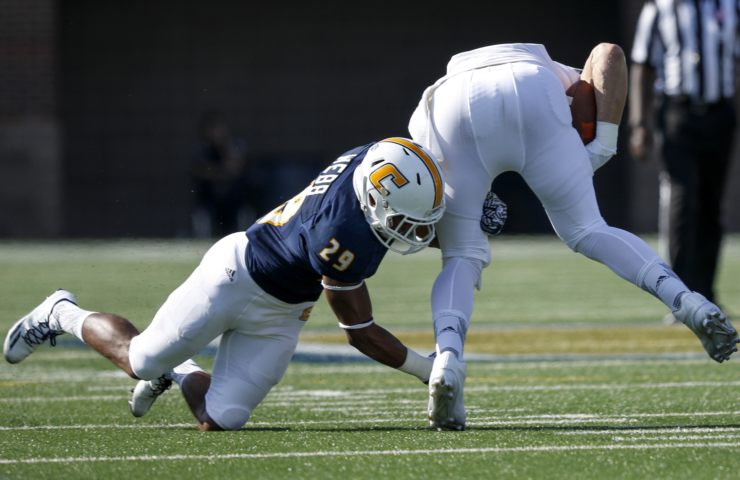 UTC defensive back Lucas Webb tackles Mercer tight end Sam Walker during the Mocs' home football game against the Mercer Bears at Finley Stadium on Saturday, Oct. 8, 2016, in Chattanooga, Tenn.