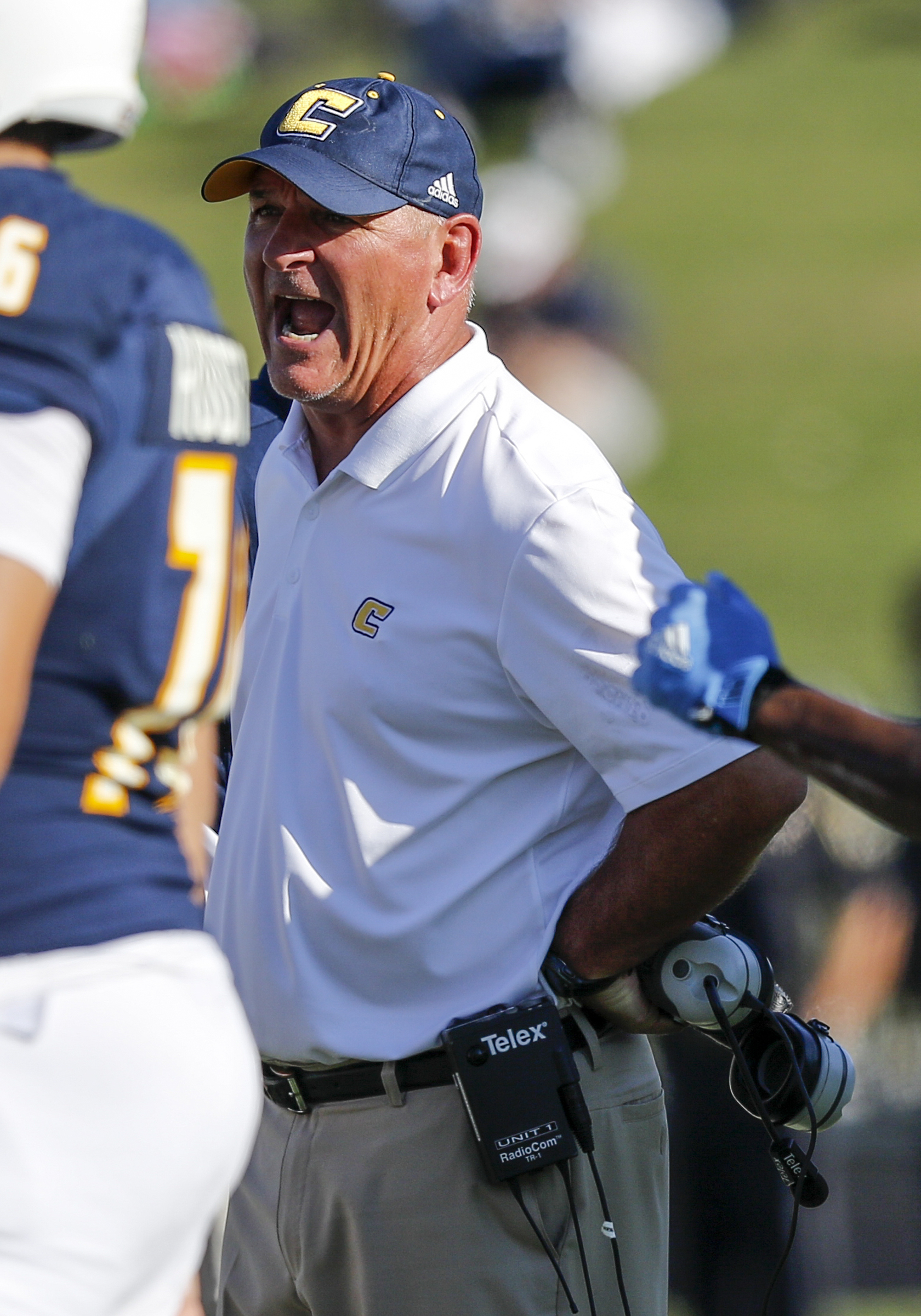 UTC coach Russ Huesman shouts to players in a timeout during the Mocs' home football game against the Mercer Bears at Finley Stadium on Saturday, Oct. 8, 2016, in Chattanooga, Tenn.