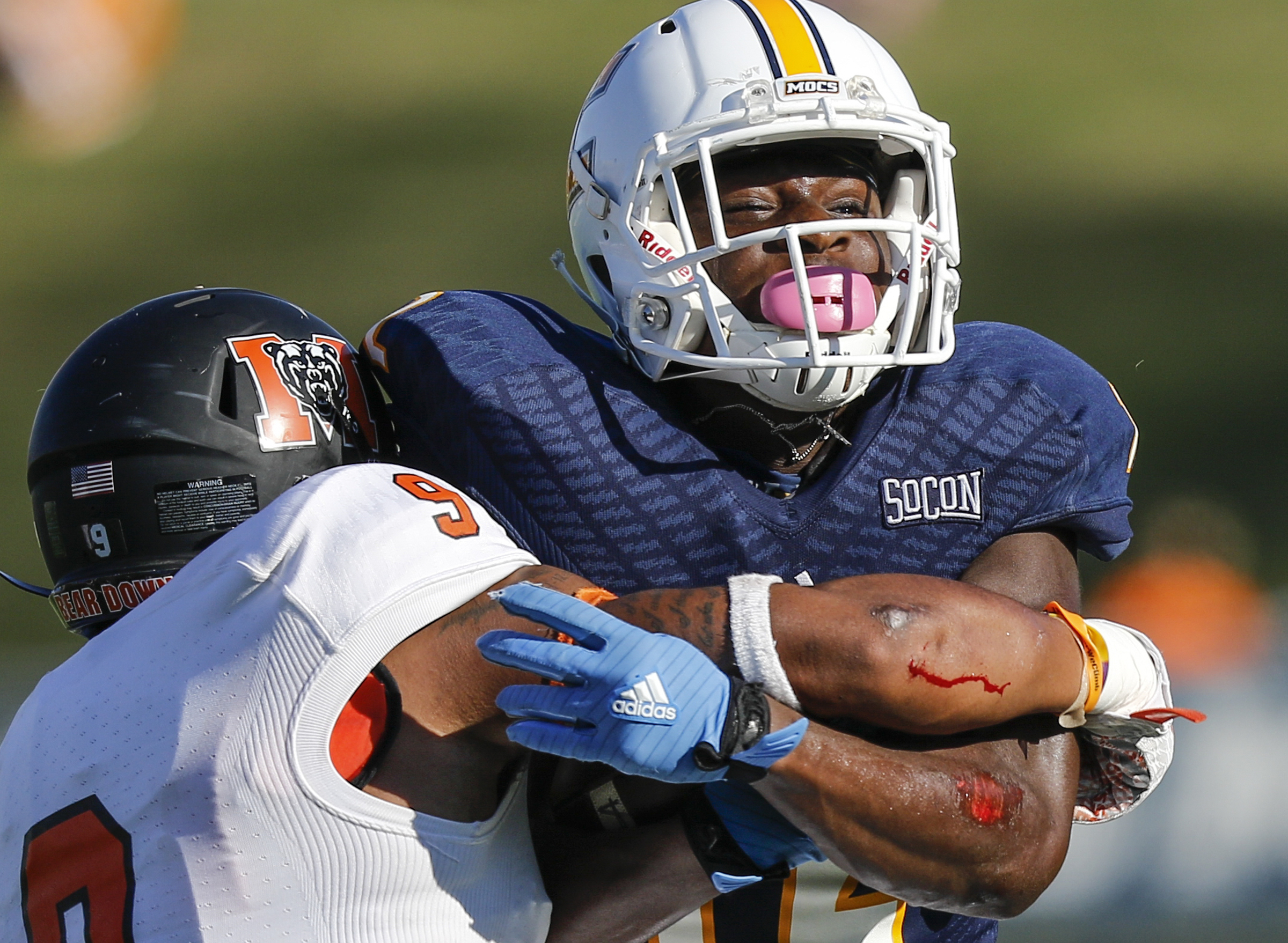 UTC wide receiver Xavier Borishade struggles against Mercer defensive back Lendell Arnold during the Mocs' home football game against the Mercer Bears at Finley Stadium on Saturday, Oct. 8, 2016, in Chattanooga, Tenn.