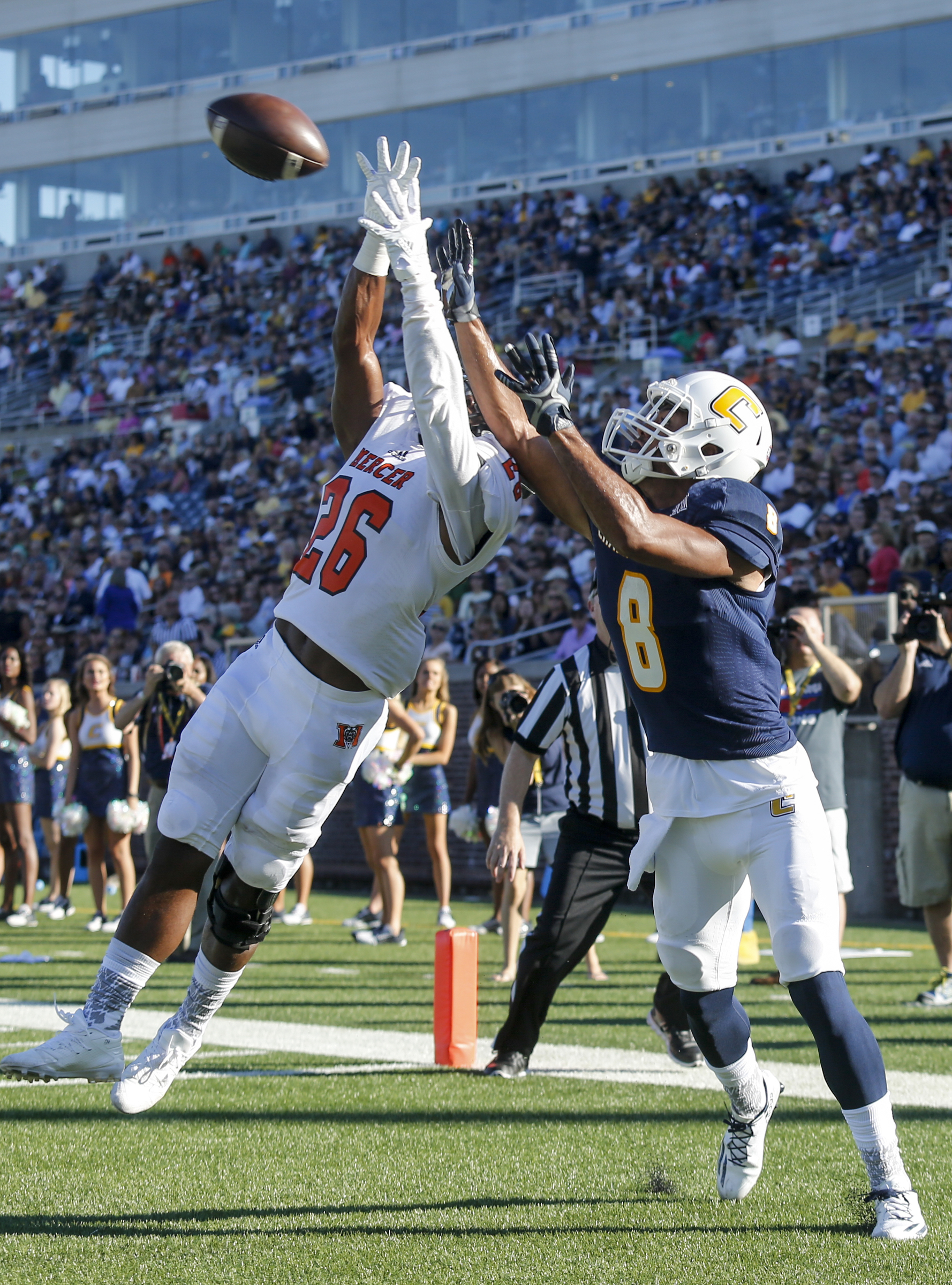 Mercer defensive back Jeremy James defends a pass to UTC wide receiver C.J. Board in the end zone during the Mocs' home football game against the Mercer Bears at Finley Stadium on Saturday, Oct. 8, 2016, in Chattanooga, Tenn.