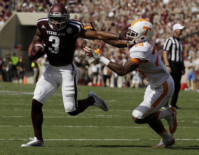 Texas A&M wide receiver Christian Kirk (3) breaks away from Tennessee defensive back Evan Berry (29) to score a touchdown after catching a pass during the first half of an NCAA college football game Saturday, Oct. 8, 2016, in College Station, Texas. (AP Photo/David J. Phillip)