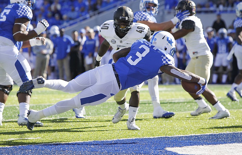 Kentucky running back Jojo Kemp (3)dives into the end zone for a touchdown in the first half of an NCAA college football game against Vanderbilt, Saturday, Oct. 8, 2016, in Lexington, Ky. (AP Photo/David Stephenson)
