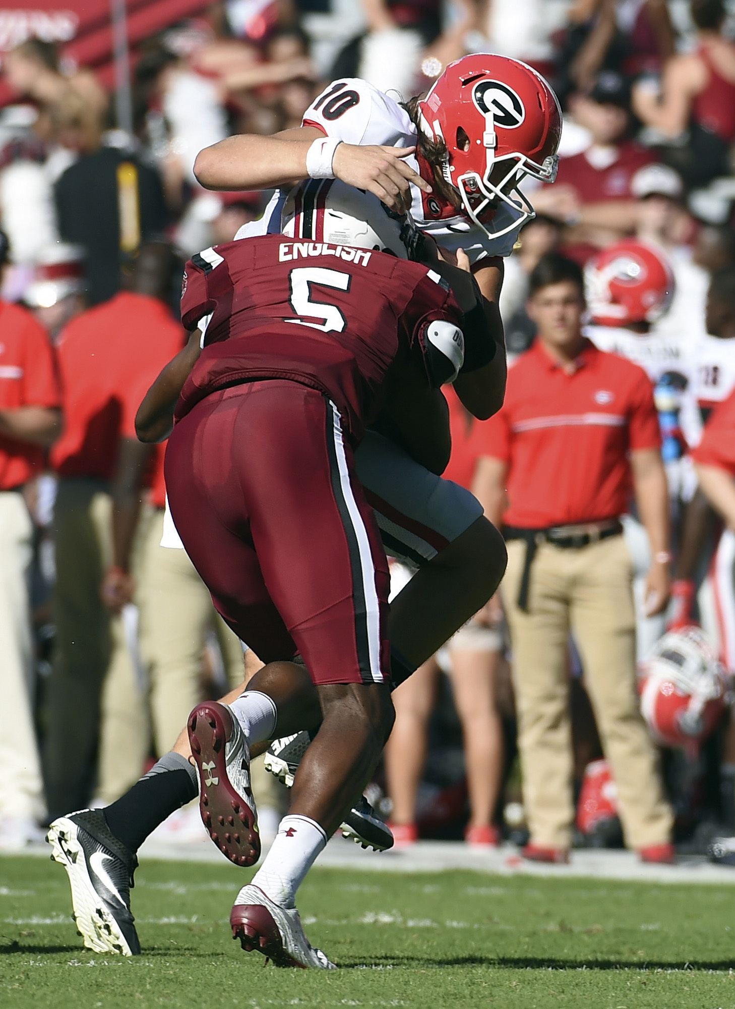 Georgia quarterback Jacob Eason (10) is sacked by South Carolina defensive lineman Darius English (5) during the first half of an NCAA college football game on Sunday, Oct. 9, 2016, in Columbia, S.C. (AP Photo/Rainier Ehrhardt)