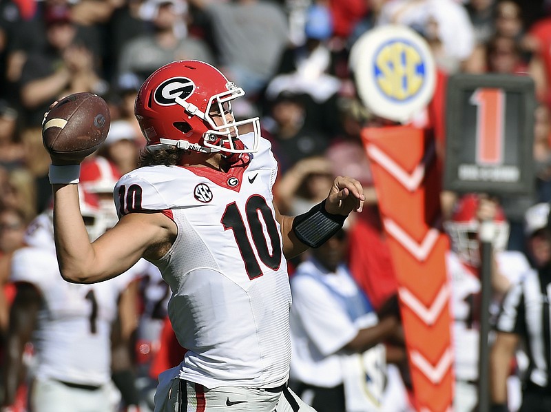 Georgia quarterback Jacob Eason (10) throws a pass during the first half of an NCAA college football game against South Carolina on Sunday, Oct. 9, 2016, in Columbia, S.C. (AP Photo/Rainier Ehrhardt)