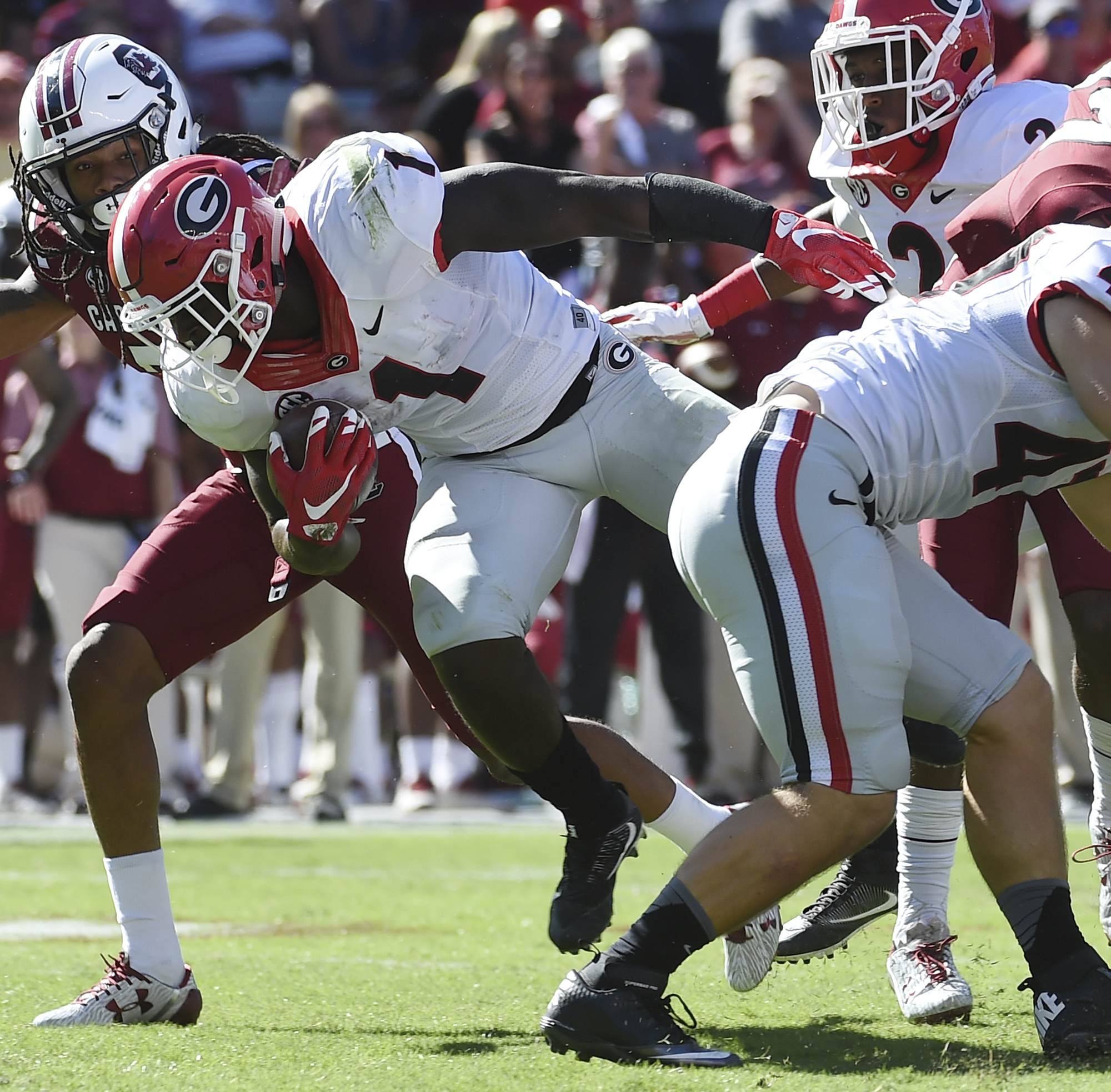 Georgia running back Sony Michel (1) runs for yardage as South Carolina defensive back Jamarcus King (7) defends during the first half of an NCAA college football game on Sunday, Oct. 9, 2016, in Columbia, S.C. (AP Photo/Rainier Ehrhardt)