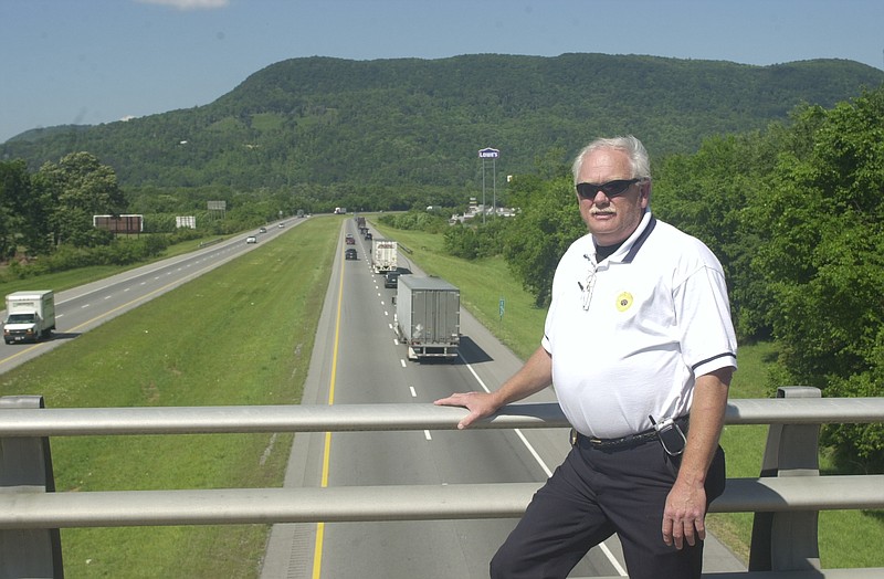 Kimball Police Chief Tommy Jordan stands on an overpass overlooking Interstate 24 in this file photo. The chief and city leaders hope a portable speed sign will help slow drivers in some parts of Kimball.