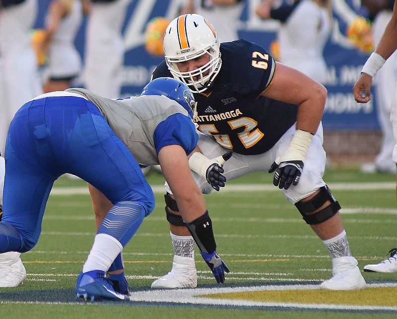 UTC left guard Corey Levin (62) concentrates on a Shorter defensive lineman.  The University of Tennessee/Chattanooga Mocs hosted the Shorter University Hawks in NCAA football action on Sept. 1, 2016. 