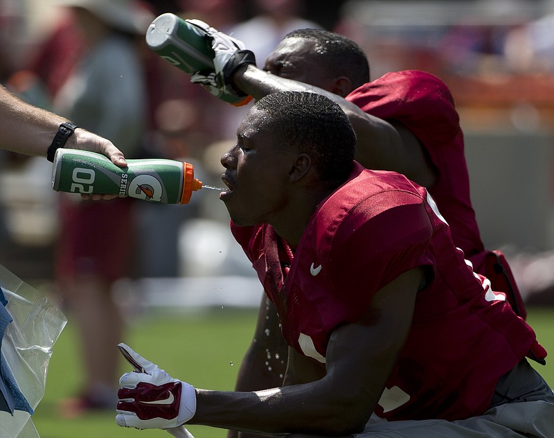 Alabama linebacker Shaun Dion Hamilton drinks water during an NCAA college football practice, Sunday, Aug. 9, 2015, in Tuscaloosa, Ala. (AP Photo/Brynn Anderson)