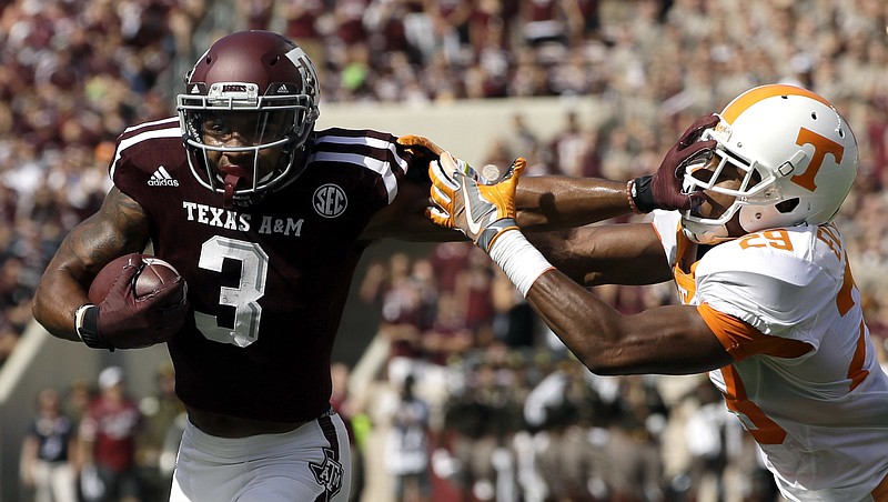 Texas A&M wide receiver Christian Kirk (3) breaks away from Tennessee defensive back Evan Berry (29) to score a touchdown after catching a pass during the first half of an NCAA college football game Saturday, Oct. 8, 2016, in College Station, Texas. (AP Photo/David J. Phillip)