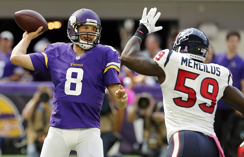
              Minnesota Vikings quarterback Sam Bradford (8) throws a pass over Houston Texans outside linebacker Whitney Mercilus, right, during the first half of an NFL football game Sunday, Oct. 9, 2016, in Minneapolis. (AP Photo/Jim Mone)
            