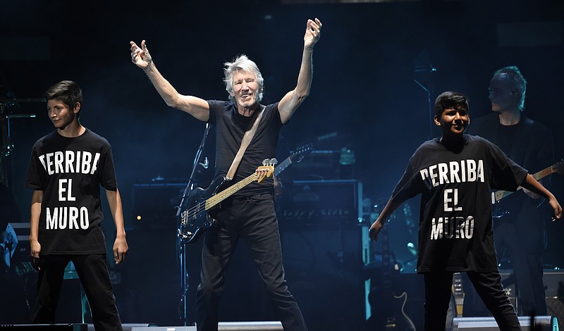 
              Roger Waters is joined onstage by children as he performs his song "Another Brick in the Wall" during his closing performance on day 3 of the 2016 Desert Trip music festival at Empire Polo Field on Sunday, Oct. 9, 2016, in Indio, Calif. (Photo by Chris Pizzello/Invision/AP)
            