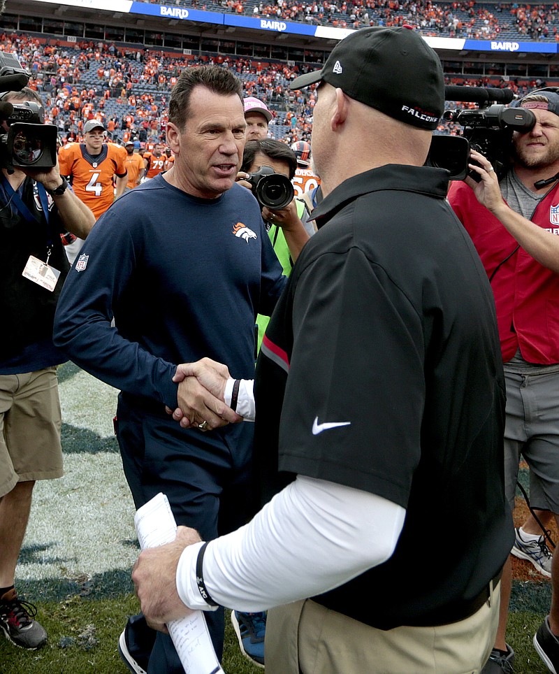 
              Denver Broncos head coach Gary Kubiak, left, greets Atlanta Falcons head coach Dan Quinn after an NFL football game, Sunday, Oct. 9, 2016, in Denver. The Falcons won 23-16. (AP Photo/Joe Mahoney)
            