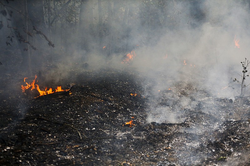 A wildfire, due to drought conditions, broke out on Bone Dry Road in Kimberly, Ala., on Monday, Oct. 10, 2016. Forestry officials are banning outside burning across most of Alabama because of fast-spreading wildfires. Coleen Vansant, of the Alabama Forestry Commission, says the fire alert took effect Monday and covers 46 of the state's 67 counties.
