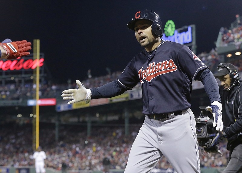 Cleveland Indians' Coco Crisp celebrates his two-run home run against the Boston Red Sox during the sixth inning in Game 3 of baseball's American League Division Series, Monday, Oct. 10, 2016, in Boston. 