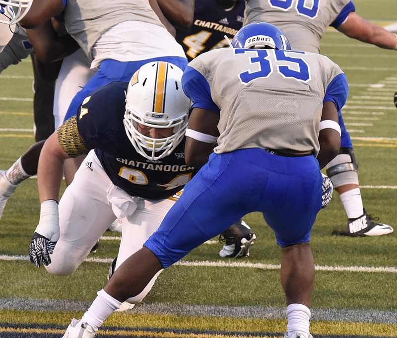 UTC defensive lineman Taylor Reynolds (94) hits Shorter's Demerious Owensby (35) in the backfield.  The University of Tennessee/Chattanooga Mocs hosted the Shorter University Hawks in NCAA football action on Sept. 1, 2016. 