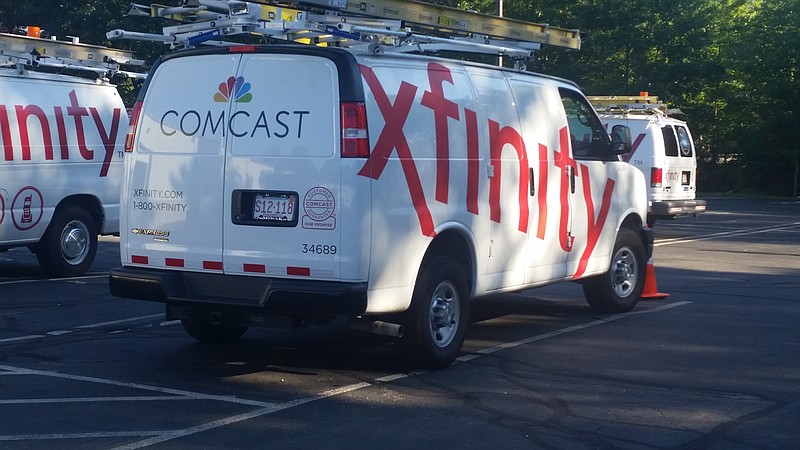 
              FILE - In this Sept. 17, 2015, file photo, Comcast trucks are parked in a lot in the company's Westford, Mass. operations center. Government regulators have fined Comcast $2.3 million, saying the cable giant has charged customers for stuff they never ordered, like premium channels or extra cable boxes. The Federal Communications Commission says the Philadelphia company must clearly ask customers before charging them for new services or equipment and make it easier for customers to fight charges they think are wrong. The company said in a statement, Tuesday, Oct. 11, 2016, that it’s been working to improve customer service and that the problems uncovered by the FCC stemmed from “isolated errors or customer confusion” rather than Comcast intentionally mischarging customers. (AP Photo/Tali Arbel, File)
            