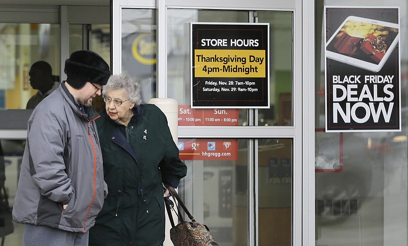 
              FILE - In this Tuesday, Nov. 25, 2014, file photo, a man and a woman leave an Hhgregg store in Mayfield Heights, Ohio. Consumer electronics chain Hhgregg Inc. has become the latest retailer to take a stand against Thanksgiving shopping and plans to close its doors for the turkey feast, announced Tuesday, Oct. 11, 2016. (AP Photo/Tony Dejak, File)
            