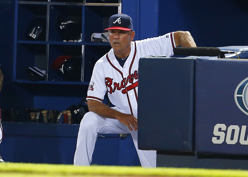 In this June 29, 2016, file photo, Atlanta Braves interim manager Brian Snitker (43) watches in the ninth inning of a baseball game against the Cleveland Indians,in Atlanta. The Braves have named Snitker as manager, Tuesday, Oct. 11, 2016, rewarding him for reversing the team's direction in his role as interim manager this season.