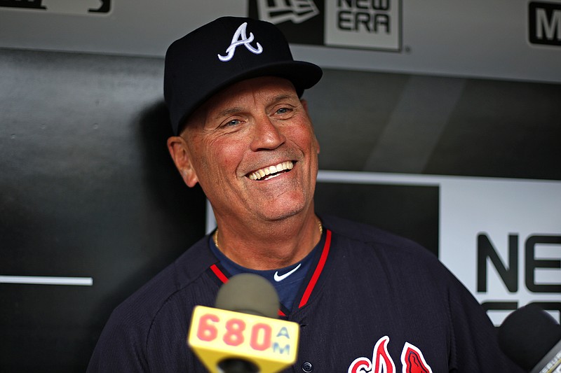 
              FILE - In this May 17, 2016, file photo, Atlanta Braves interim manager Brian Snitker talks with reporters in the dugout before the team's baseball game against the Pittsburgh Pirates in Pittsburgh. The Braves have named Snitker as manager, Tuesday, Oct. 11, 2016, rewarding him for reversing the team’s direction in his role as interim manager this season.  (AP Photo/Gene J. Puskar, File)
            