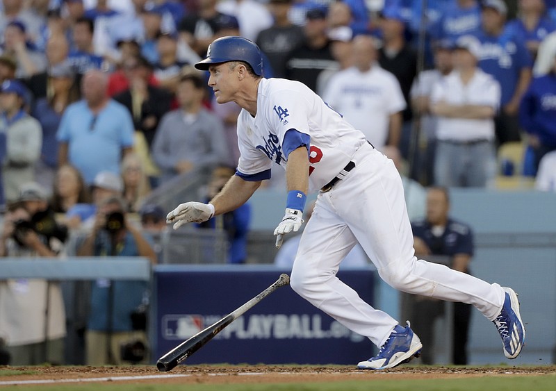 Los Angeles Dodgers' Chase Utley watches his RBI-single during the eighth inning in Game 4 of a baseball National League Division Series against the Washington Nationals in Los Angeles, Tuesday, Oct. 11, 2016.