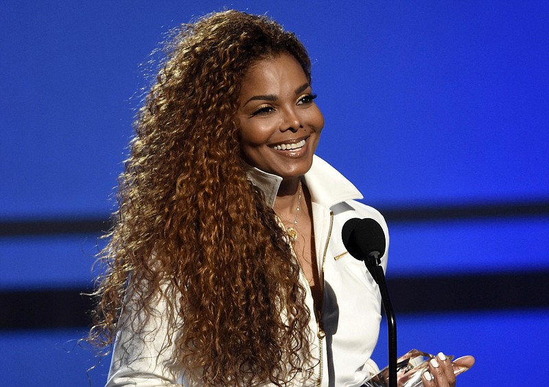 
              FILE - In this June 28, 2015, file photo, Janet Jackson accepts the ultimate icon: music dance visual award at the BET Awards in Los Angeles. Janet Jackson has confirmed she's pregnant at 50. The star showed off her baby bump in a photo Wednesday, Oct. 12, 2016, smiling in a white dress and cradling her belly. (Photo by Chris Pizzello/Invision/AP, File)
            