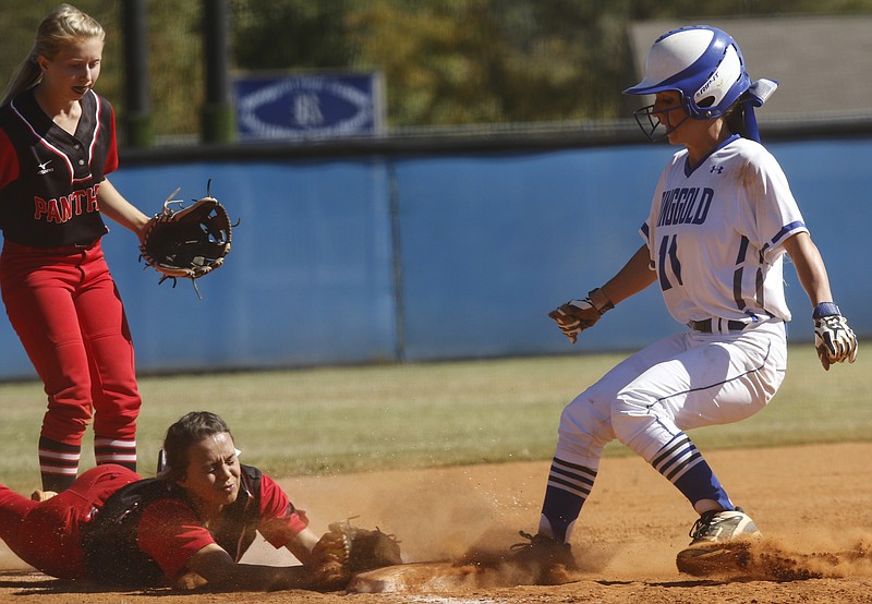 Ringgold runner Ally Ellis reaches 3rd before a force tag attempt by Jackson County 3rd baseman Serina Bergeron during Ringgold's GHSA Class AAA softball playoff game against Jackson County at Ringgold High School on Wednesday, Oct. 12, 2016, in Ringgold, Ga.