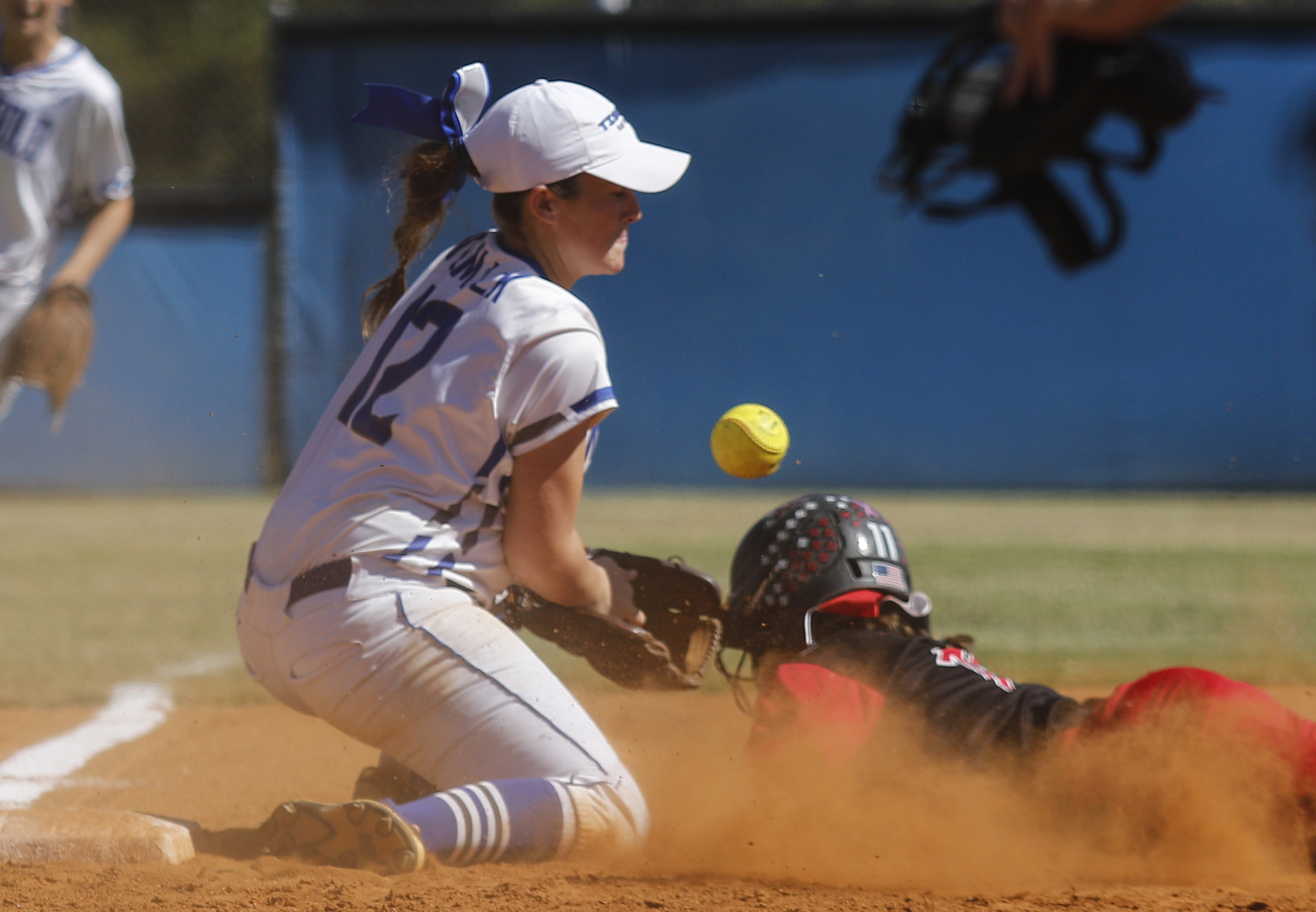 The ball comes free from Ringgold 3rd baseman Kaylee Womack's glove as Jackson County runner Serina Bergeron slides in during Ringgold's GHSA Class AAA softball playoff game against Jackson County at Ringgold High School on Wednesday, Oct. 12, 2016, in Ringgold, Ga.