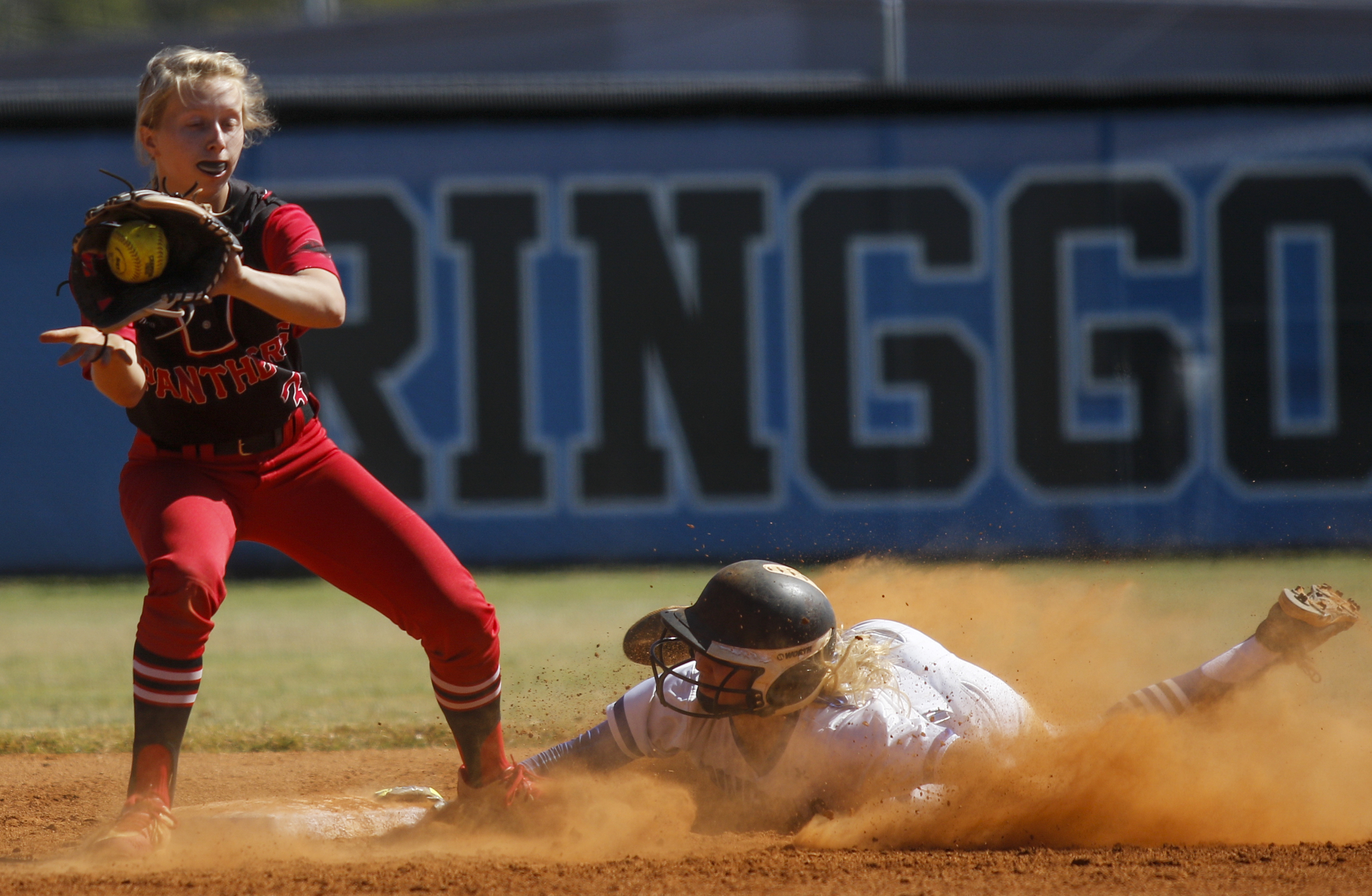 Ringgold runner Karoline Sholl slides into 2nd ahead of the throw to Jackson County infielder Jordan Scott during Ringgold's GHSA Class AAA softball playoff game against Jackson County at Ringgold High School on Wednesday, Oct. 12, 2016, in Ringgold, Ga.