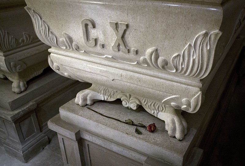 
              This photo from Friday, Oct. 7, 2016, shows sarcophagus of king Charles X and a rose, inside the crypt of the Kostanjevica monastery in Nova Gorica, Slovenia. The only French king buried outside France, Charles X was laid to rest in Nova Gorica nearly 200 years ago, after fleeing a French revolution. Recently, a group of historians and royalists in France have been campaigning to have the king's remains reburied back home. (AP Photo/Darko Bandic)
            