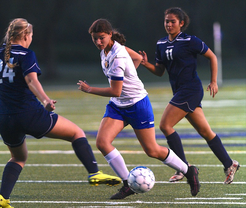 Boyd Buchanan's Emilly Hauke and Chattanooga School for the Arts and Sciences' Lauren Huffington (24) and Sophie Albarakat (11) pursue the ball Thursday, October 13, 2016 Boyd Buchanan.